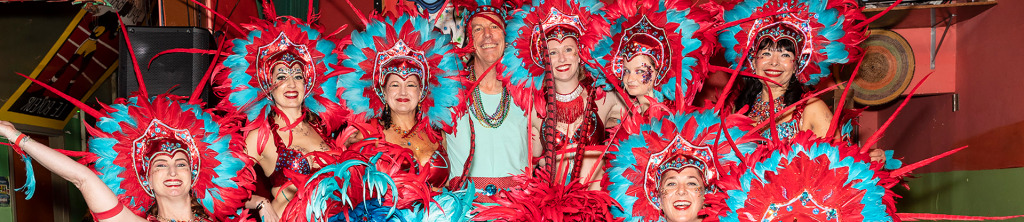 Carnaval dancers with blue and red feather headpieces